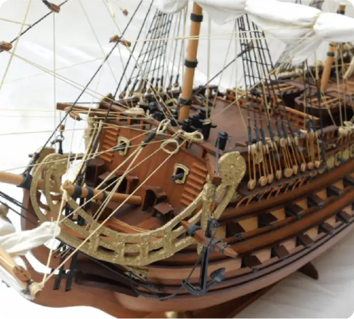 Artistic profile of a vintage sailing ship model by a celebrated maker of maquettes de bateaux in Mauritius.
