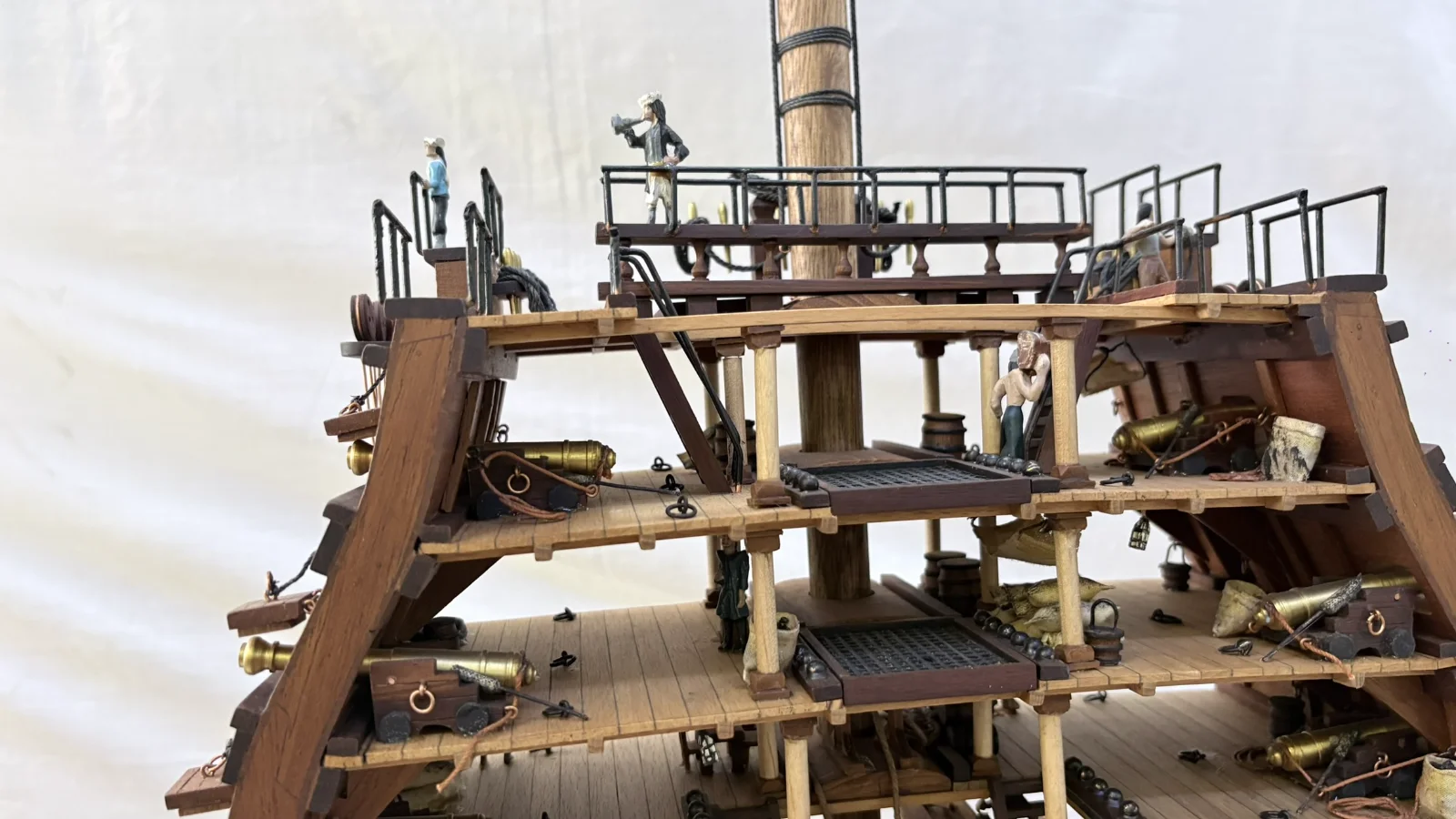 Handcrafted wooden ship model cross section showing detailed internal decks and framing
