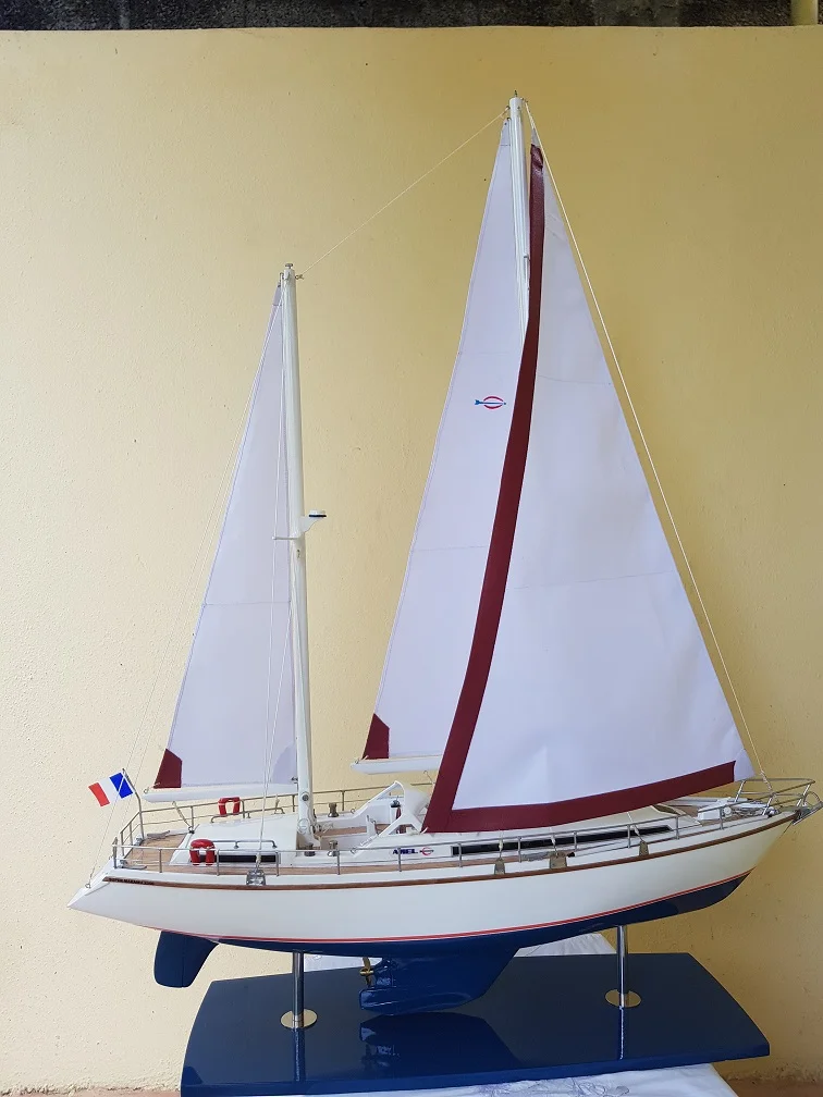 Custom handcrafted luxury wooden scale model of the Super Maramu cruising yacht on a premium display base.