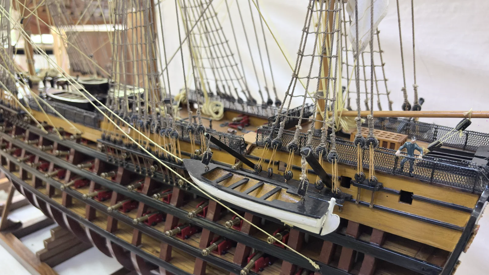 Large handcrafted 1m 35cm wooden HMS Victory ship model with cutaway hull revealing interior decks