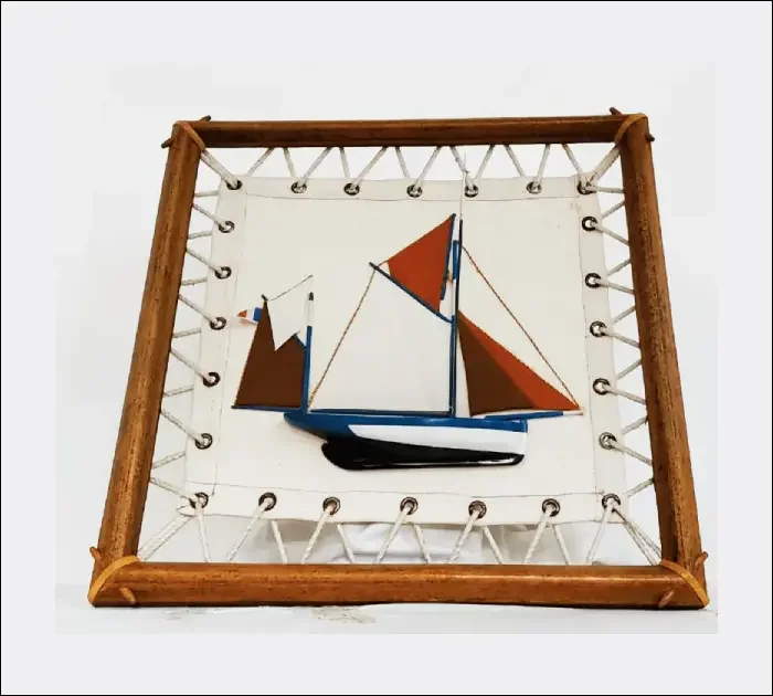 Handcrafted wooden model ship of the traditional French Atlantic tuna fishing boat, Thonier de Groix, with detailed rigging and masts.