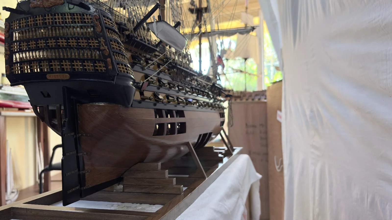 Large handcrafted 1m 35cm wooden HMS Victory ship model with cutaway hull revealing interior decks