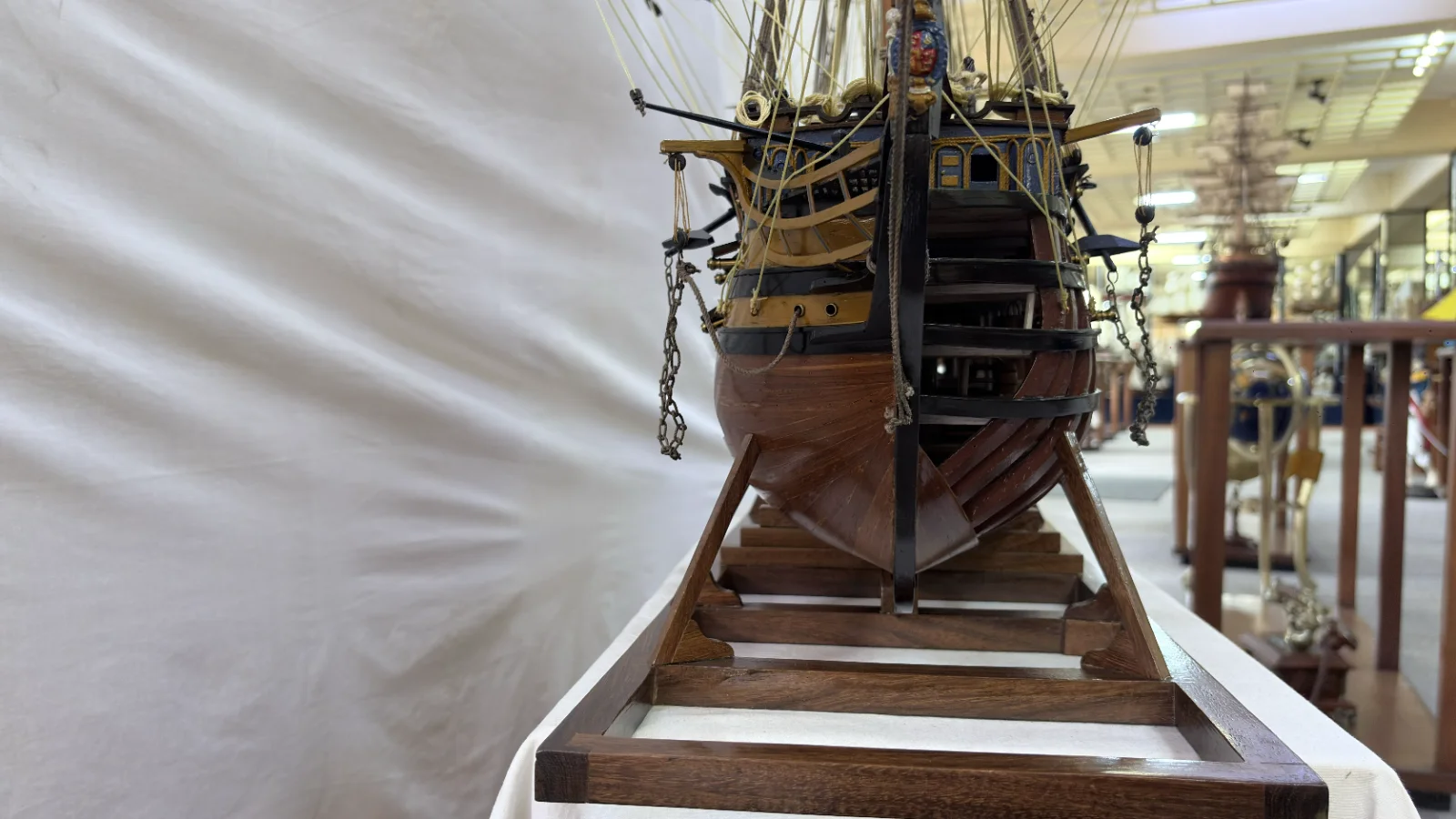 Large handcrafted 1m 35cm wooden HMS Victory ship model with cutaway hull revealing interior decks