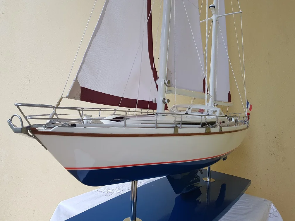 Custom handcrafted luxury wooden scale model of the Super Maramu cruising yacht on a premium display base.
