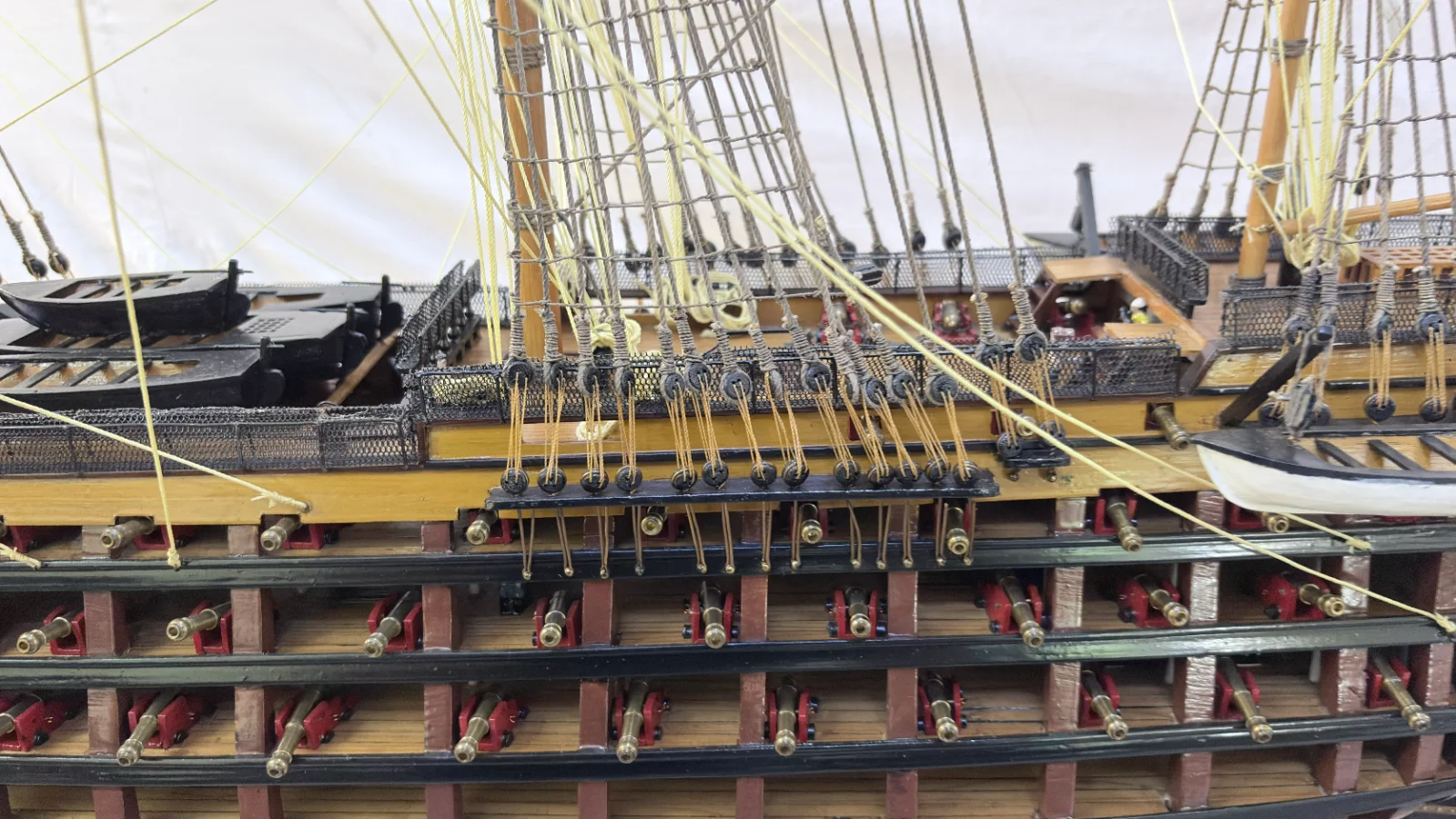 Large handcrafted 1m 35cm wooden HMS Victory ship model with cutaway hull revealing interior decks