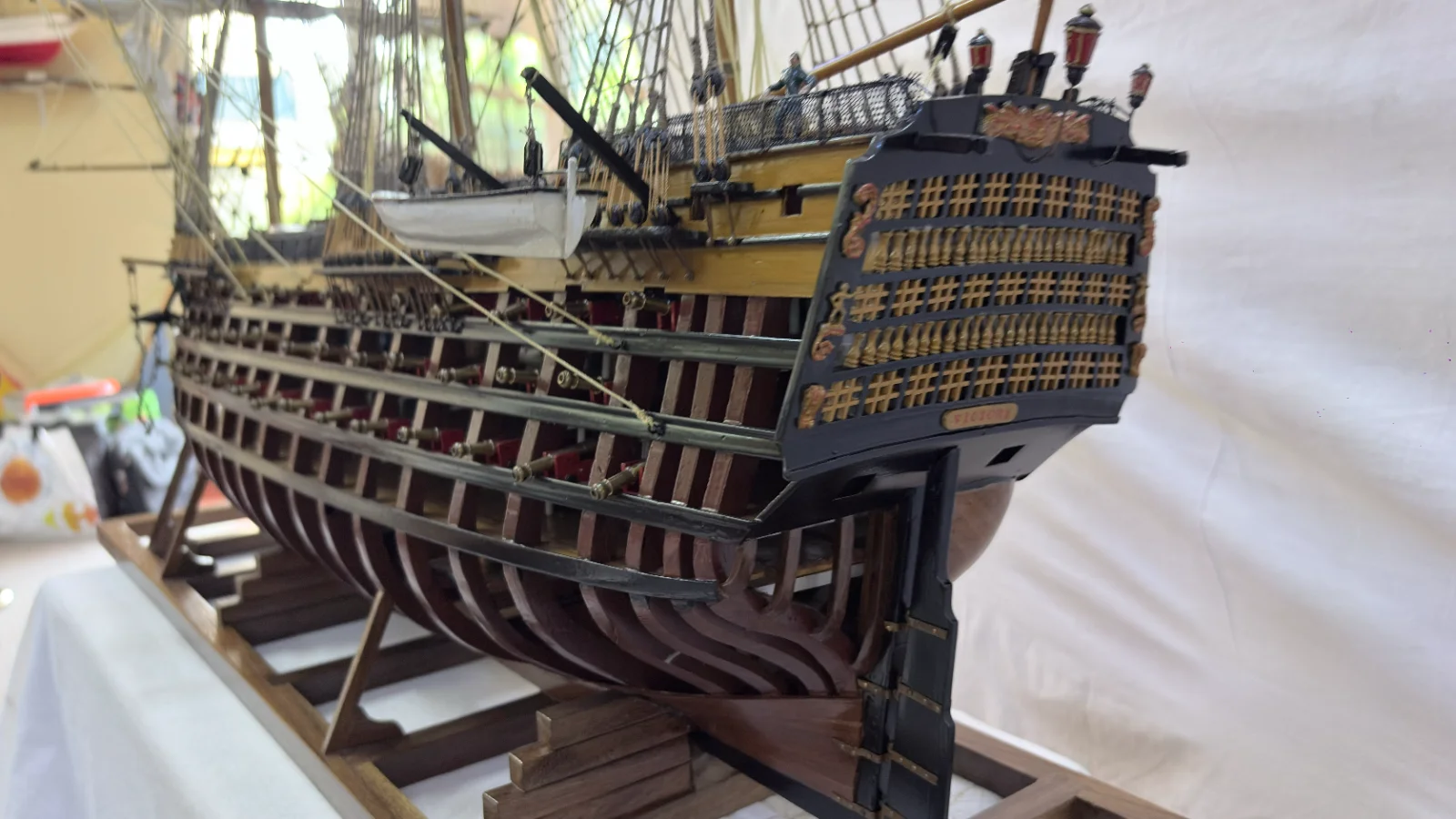 Large handcrafted 1m 35cm wooden HMS Victory ship model with cutaway hull revealing interior decks