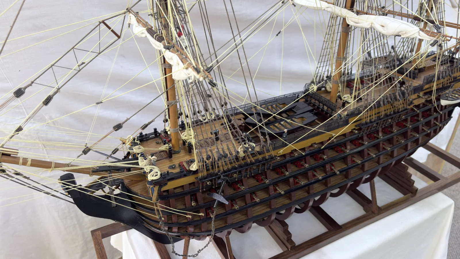 Large handcrafted 1m 35cm wooden HMS Victory ship model with cutaway hull revealing interior decks