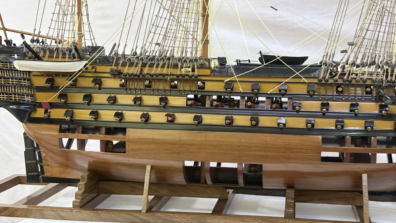 Large handcrafted 1m 35cm wooden HMS Victory ship model with cutaway hull revealing interior decks