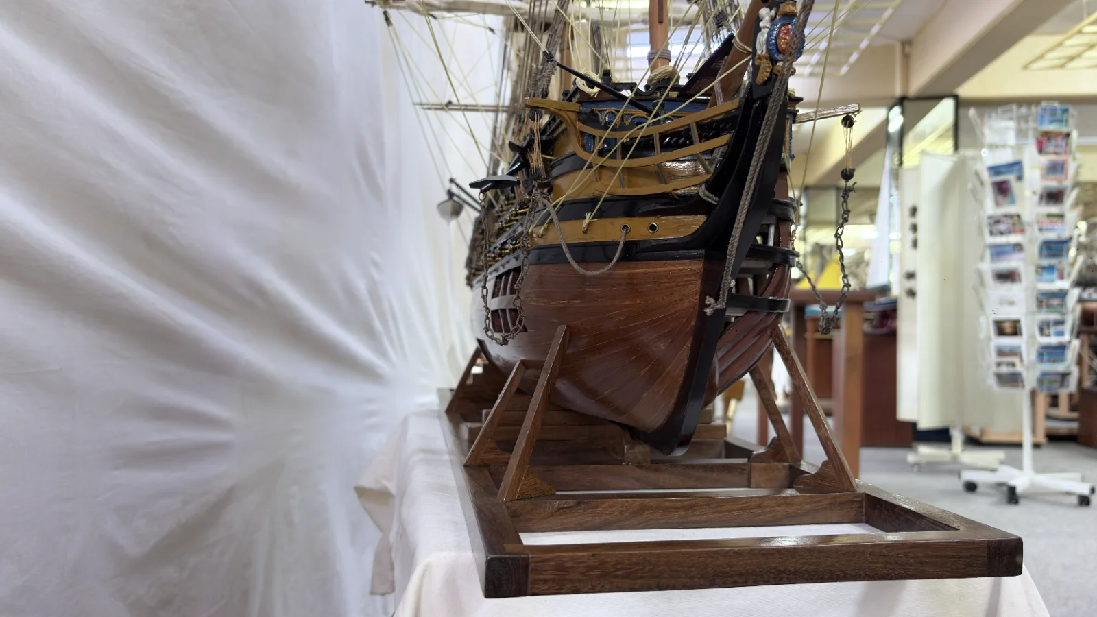 Large handcrafted 1m 35cm wooden HMS Victory ship model with cutaway hull revealing interior decks