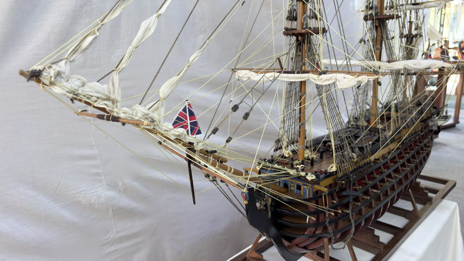 Large handcrafted 1m 35cm wooden HMS Victory ship model with cutaway hull revealing interior decks