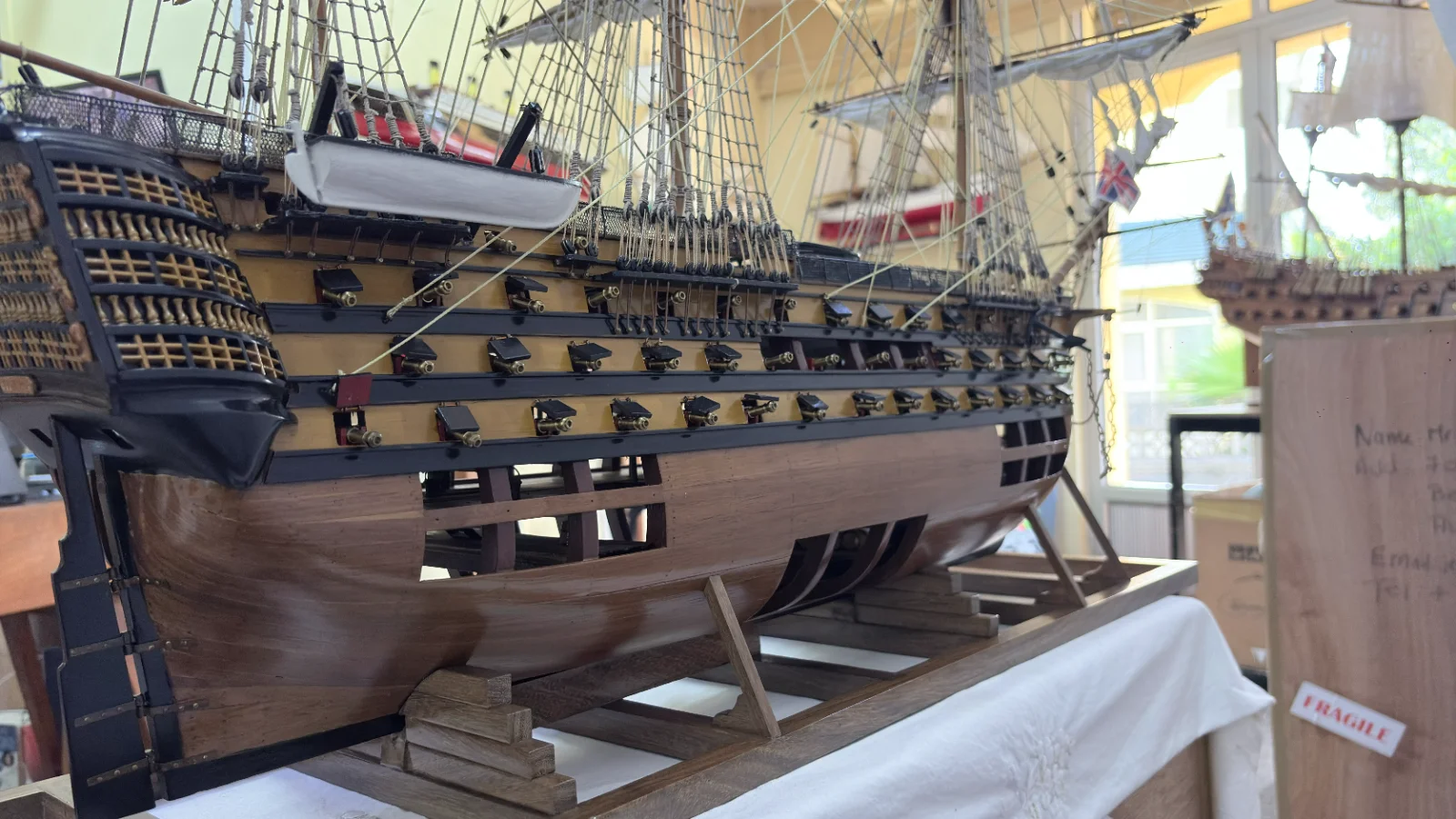Large handcrafted 1m 35cm wooden HMS Victory ship model with cutaway hull revealing interior decks