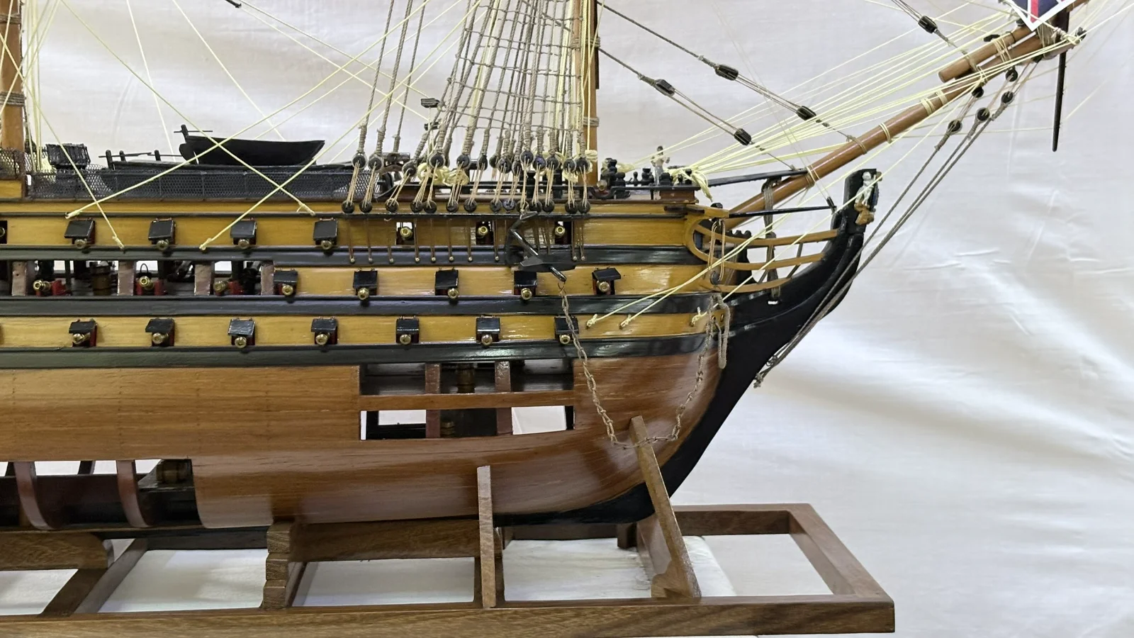 Large handcrafted 1m 35cm wooden HMS Victory ship model with cutaway hull revealing interior decks