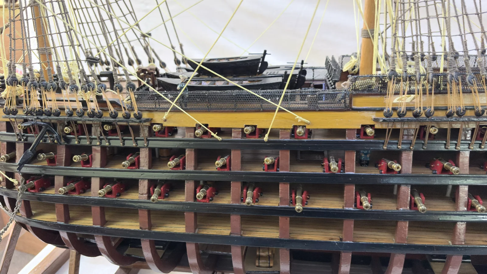 Large handcrafted 1m 35cm wooden HMS Victory ship model with cutaway hull revealing interior decks