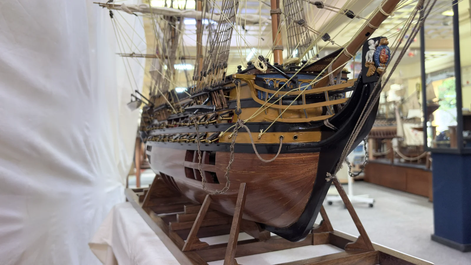 Large handcrafted 1m 35cm wooden HMS Victory ship model with cutaway hull revealing interior decks